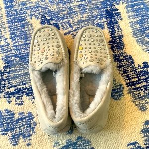Ugg slippers never worn, still have sticker on the back